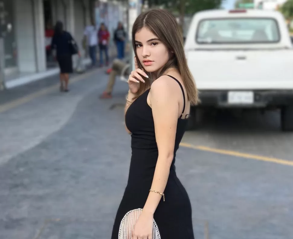 Gaby Gardez Erome in dress standing on the street in front of a white truck in mexico 