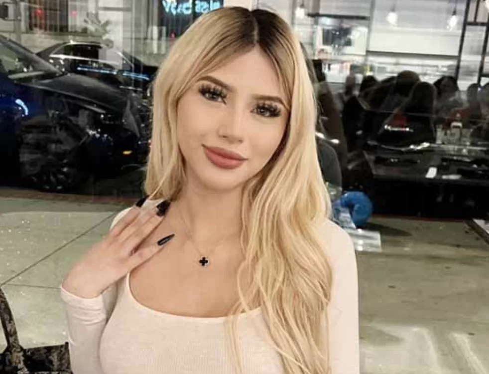 Gia Lover candid selfie in front of cars touching hair